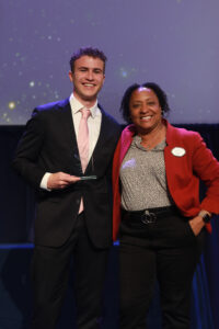 Dean of Students and Associate Vice President for Student Affairs Melissa Jones poses with UMW senior Christopher Anderson, one of three award-recipients who won the In the Wings Award during the Eagle Awards ceremony. Associate Athletic Director Caitlin Moore and Assistant Director of New Student Programs Lillian Lester also won the In the Wings Award. Photo by Karen Pearlman.