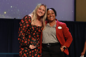 Dean of Students and Associate Vice President for Student Affairs Melissa Jones (right) poses with Assistant Director of New Student Programs Lillian Lester, one of three winners who received the In the Wings Award. UMW senior Christopher Anderson and Associate Athletic Director Caitlin Moore, who was not present for the event, also won the In the Wings Award. Photo by Karen Pearlman.Photo by Karen Pearlman.