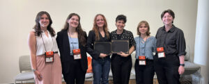 'Scholar of the Year' award winners Rylee Vann and Daphne Bobb (center) pose with fellow UMW Honors students at the Virginias Collegiate Honors Council (VCHC) Conference.