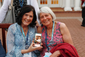 1974 alumnae pose for a photo, while also sharing a few of their younger selves, during their 50th reunion dinner at the Jepson Alumni Executive Center. Photo by Karen Pearlman.