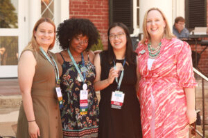 Young alumni pose for a photo with Vice President for Advancement and Alumni Engagement and UMW Foundation Executive Director Katie Turcotte (right) in 2024. Photo by Karen Pearlman.