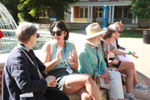 Alumni sit for a spell at the fountain on Palmieri Plaza in front of Monroe Hall, one of the most popular spots on the UMW campus. Photo by Karen Pearlman.
