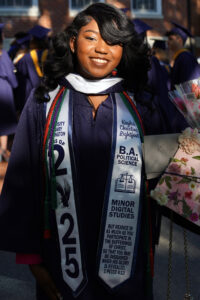 Graduate Kaylah Lightfoot likened her college career to the blooming of a flower, like the ones she’d pasted to her mortarboard. Photo by Suzanne Carr Rossi.