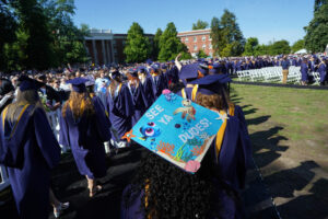 Decorated mortarboards gave glimpses into graduates' personalities and student life, and members of the Class of 2025 expressed a range of emotions - including relief - during the University of Mary Washington's 114th commencement ceremony. Photo by Suzanne Carr Rossi.