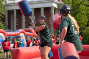 A variety of inflatables, like this gladiator-style game get spirit pumping on Ball Circle and other areas of campus during Devil-Goat Day. Photo by Parker Michels-Boyce.
