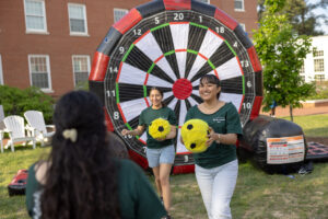 Assorted lawn games like volleyball and this giant version of darts dotted 'The Beach' area outside Randolph and Mason halls. Photo by Parker Michels-Boyce.