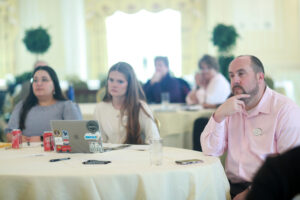 From right: Alumni Board member Brian Reagan ’04 and Young Alumni Council members Mary-Elise Alworth ’23 and Brooke Robertson ’21 listen to the Fund for Mary Washington Impact Grant presentations. Photo by Karen Pearlman.