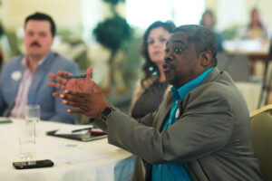 From right: Alumni Board member Sye Smith ’96 asks a question of a presenter while Young Alumni Council member Melisa Levine ’17 and YAC Vice Chair Reid Merritt ’20 look on. Photo by Karen Pearlman.