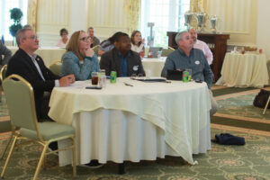 From left: Alumni Association Board of Directors President James Llewellyn ’87, Vice President for Advancement and Alumni Engagement and UMW Foundation Executive Director Katie Turcotte and Alumni Board members Harry Thomas ’96 and Brendan Kelly ’95 listen to presentations before awarding Fund for Mary Washington Impact Grants in April. Photo by Karen Pearlman.