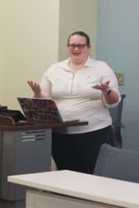 Junior education major Maddy Woodard speaks about her project that helps teachers integrate arts into the classroom. Photo by Karen Pearlman.