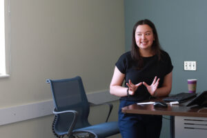 Junior biological sciences major Sabrina Perez helps her team present their project on how physical activity affects anxiety. Photo by Karen Pearlman.