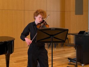 UMW music student Angus Frazier performs on violin during the 19th annual Research and Creativity Day. Photo by Lisa Marvashti.