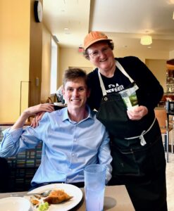 Will Thompson poses with Campus Dining employee and Special Olympian golfer Grace Anne Braxton outside Panera Bread in the Cedric Rucker University Center. Thompson describes Braxton as 'a great friend and supporter for me over the course of my whole career at UMW.'