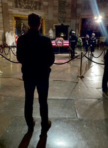 UMW senior Will Thompson, who served during the 2024-25 school year as Student Government Association president, majored in international business. But his college exposure to courses in political science fed his passion for civic engagement and led him to multiple internships in the U.S. House of Representatives. Thompson is seen here looking on as Jimmy Carter lies in state in the U.S. Capitol Rotunda.