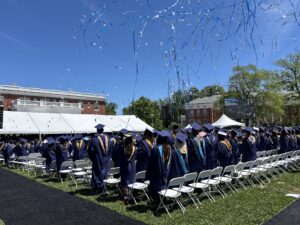 Blue skies provided the perfect backdrop for the streamers and confetti that showered graduates at the end of the ceremony. Photo by Amy Jessee.