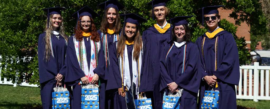 Graduates Bonnie Butler, Kathleen Conner, Thomas Held, Austin Moore, Jessica Oberlies, Kelsey Payne and Maria Werner earned the Colgate W. Darden Jr. Award for Academic Achievement for completing their degrees with the highest grade-point average in the undergraduate program. Photo by Suzanne Carr Rossi.