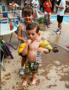 Diederich, pictured here with yellow floaties, started swimming at an early age growing up in northern Virginia.