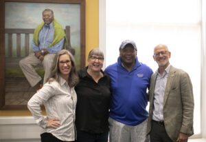 From left to right: Artist Nicole Horn poses with Professor Emerita of Art Carole Garmon, Dean of Student Life Emeritus Cedric Rucker '81 and UMW President Troy Paino after the unveiling of Rucker's portrait inside the Cedric Rucker University Center. The building was named for the longtime - and beloved - Mary Washington administrator. Photo by Karen Pearlman.