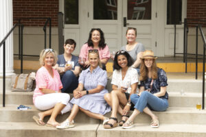 Alumni pose for a picture after the Virginia wine, beer and cider tasting, held in Monroe Hall this year. Photo by Karen Pearlman.