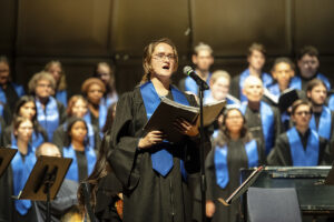 Taylor rehearses with UMW’s combined choirs in 2024. Photo by Tom Rothenberg.