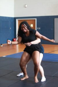 High schoolers practice the art of jiu-jitsu. Other enrichment sessions focused on tennis, fishing, museum tours, crafts and more. Photo by K Pearlman Photography.