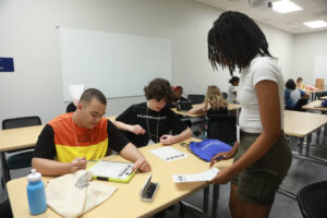 Livia Lee, a rising junior at Nottoway High School plays Getting to Know You BINGO with classmates during UMW's Summer Enrichment Program. The six-day experience for rising 10th- through 12th-graders gives high-schoolers, who take courses, join excursions and live on campus, a taste of college life. Photo by K Pearlman Photography.
