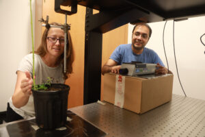 Assistant Professor of Biology Lauren Cirino and Assistant Professor of Physics Varun Makhija help students set up an experimental design using a laser vibrometer. Photo by Karen Pearlman.