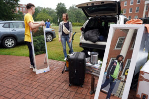 Wednesday's Move-In Day at the University of Mary Washington welcomed hundreds of first-year students. For families bringing their loved ones to their new UMW homes, it's always a bittersweet occasion, but lots of move-in volunteers were on hand to lighten their load. Photo by Suzanne Carr Rossi.