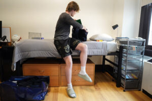 First-year student Garrett Effley of Oakton, Virginia, gets acquainted with his new room in Virginia Hall. He and his family visited UMW four times before committing and got "really good vibes" from their conversations with Mary Washington's Admissions team. Photo by Suzanne Carr Rossi.