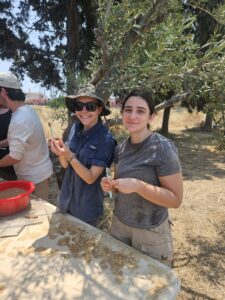 Working directly alongside professionals and faculty, UMW students (pictured L-R: Eve Stewart and Cynthia Seeds) helped with excavation, hauling and sifting soil, cleaning and sorting pottery fragments, and documenting discoveries through field notes and photographs.