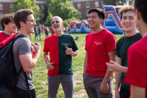 President Paino is seen here conversing with students during the uniquely UMW tradition of Devil Goat Day, celebrating its 100th anniversary this year.