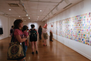 At the opening receptions for 'Intersection' and 'Take a Paining' this month gallery visitors view the artwork meant to spark creativity and conversation. Photo by Nellie Bittenbender.