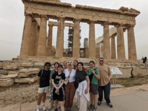 UMW Classics Abroad group poses in front of the Parthenon in Athens, Greece during spring break 2025.