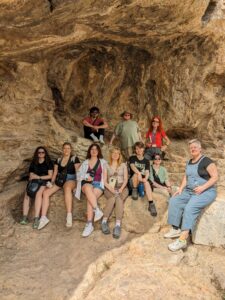 This faculty-led Classics Abroad group pose with their Professor Angela Pitts in Greece during spring break 2025.