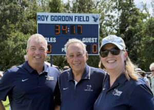 In addition to President Troy Paino, Coach Gordon (center) thanked current UMW Director of Athletics Patrick Catullo '95 (left) and Vice President for Advancement and Alumni Engagement Katie Turcotte (right), who is also executive director of the UMW Foundation. Both worked with dedicated alumni to reach out to men's and women's soccer supporters. Photo courtesy of Katie Turcotte.