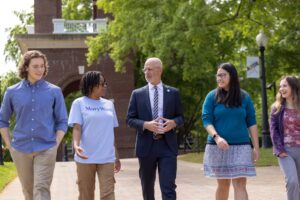 University of Mary Washington President Troy Paino, seen here talking with UMW students on Campus Walk, has received prestigious honors from two notable publications - 'Virginia Business' and 'Northern Virginia Magazine.'