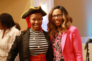 Associate Provost for Community Relations and Compliance Shavonne Shorter brought her exuberant energy to her post as emcee of the Employee Appreciation Luncheon. Photo by Karen Pearlman.