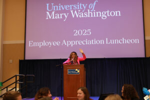 Associate Provost for Community Relations and Compliance Shavonne Shorter brought her exuberant energy to her post as emcee of the Employee Appreciation Luncheon. Photo by Karen Pearlman.