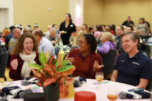 From left to right: Digital Knowledge Center Associate Director Shannon Hauser, Center for Prevention and Education Director Marissa Miller and Digital Learning Support Director Jerry Slezak chat during the Employee Appreciation Luncheon. Photo by Karen Pearlman.