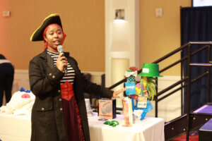 Student Transition, Access and Retention Assistant Director Shanita Mitchell prepares to door prizes to lucky winners during the Employee Appreciation Luncheon. Photo by Karen Pearlman.