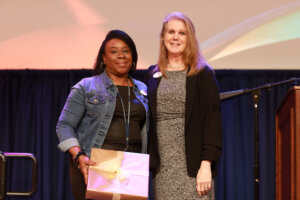 Accounts Payable Manager Lauren Bass (right), who is also president of the University Staff Council, poses with Assistant Director of Financial Aid Alicia Tisdale, who received the USC's Larry Atkins Award in the Classified Employee Category. Photo by Karen Pearlman.