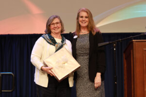Accounts Payable Manager Lauren Bass (right), who is also president of the University Staff Council, poses with Director of Donor Relations in Advancement Maureen Aylward, who received the USC's Larry Atkins Award in the A/P Faculty Category. Photo by Karen Pearlman.