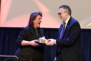 Chief of Staff and Vice President of Strategy Jeff McClurken presents Student Life Office Manager and Fiscal Technician Mary Bullock with the Charles Coleman Service Award. Photo by Karen Pearlman.
