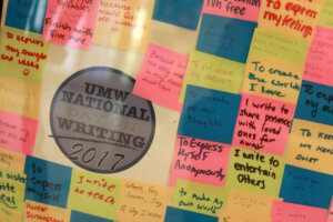 Many “Why I Write” Post-it Notes collected over the years during the annual celebration of National Day on Writing. Photo by Karen Pearlman.