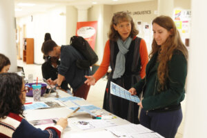 Associate Professor of Writing Studies and Digital Studies Brenta Blevins talks to students in Combs Hall, home to the Department of English and Linguistics. Photo by Karen Pearlman.