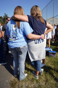 Friends and classmates reconnect on campus, celebrating shared memories and Eagle pride during Homecoming weekend.