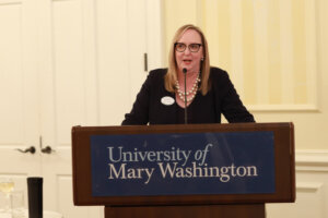 UMW Vice President for Advancement and Alumni Engagement Katie Turcotte addresses the crowd at last night's unveiling event for the 2026 William B. Crawley Great Lives Lecture series. Photo by K Pearlman Photography.