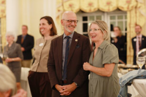 UMW President Troy Paino, who addressed the crowd, shares a laugh with wife Kelly at last week's unveiling event for the 2026 William B. Crawley Lecture Series.