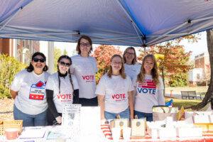 Volunteers with UMW Votes staffed tables to assist fellow students on Election Day (Pictured: Stephanie Turcios, Sarah Tyree-Herrmann, Finley Jones, Zoe Rapp, Sarah Dewees, Elizabeth Babcock). Photo by Sam Cahill.