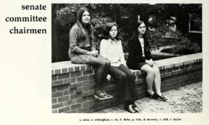 1971 Yearbook photo of three Mary Washington students sitting on a wall on Campus Walk. Caption reads: Senate Committee Chairmen.